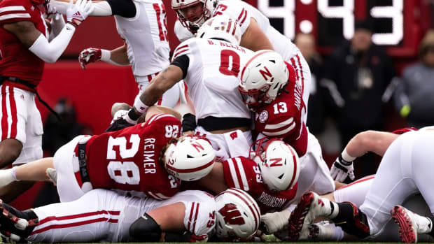 Malcolm Hartzog and Luke Reimer and Ty Robinson tackle vs Wisconsin 2022 Nebraska football